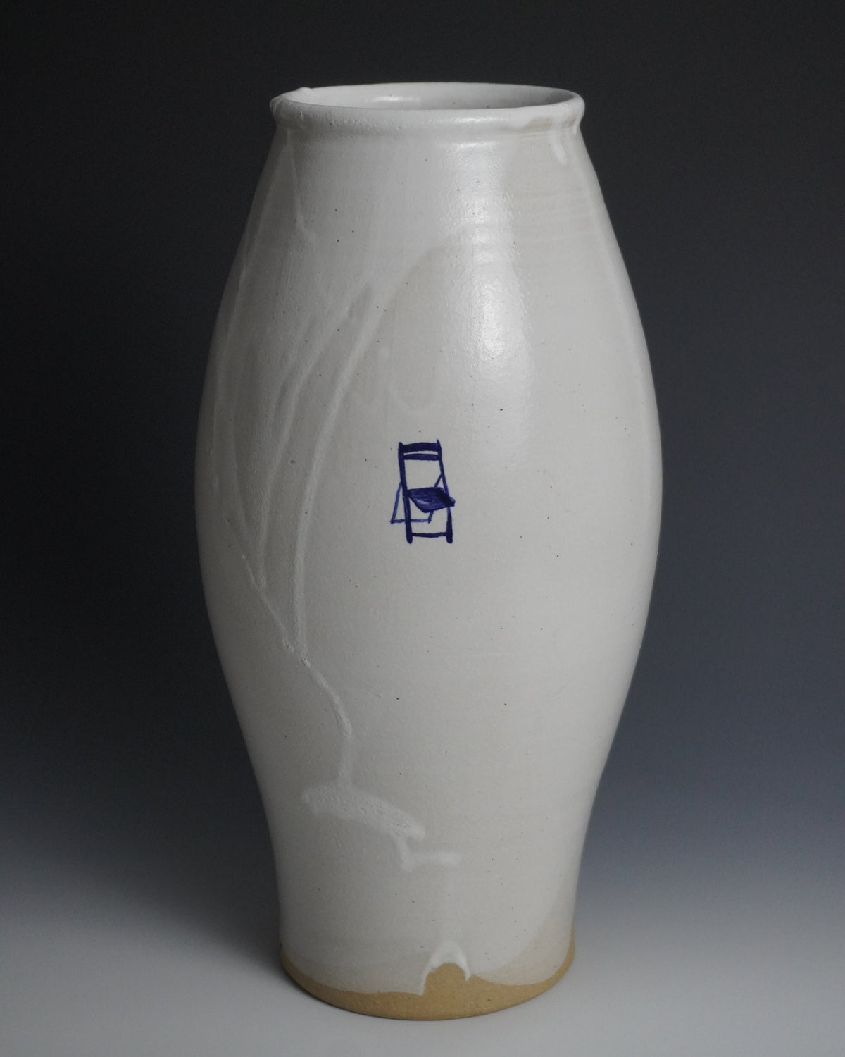 Glazed white ceramic vase with a blue and painted chair.